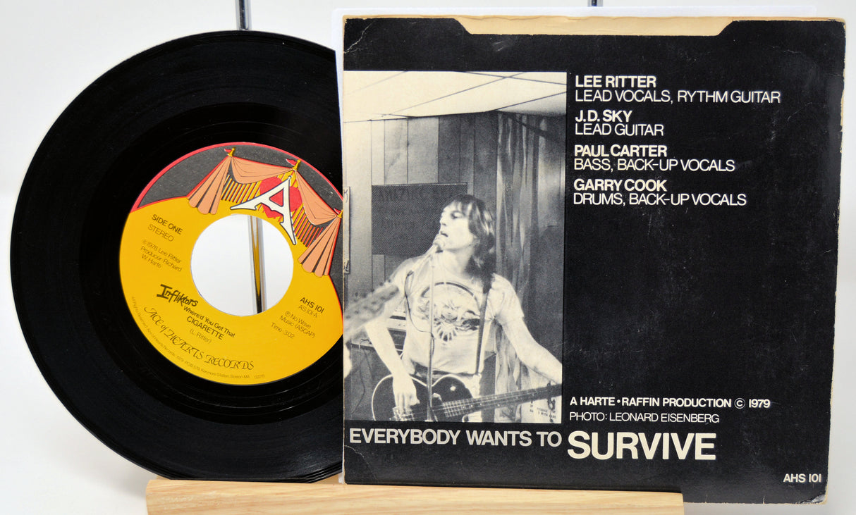 Vinyl record and its cover with text and a black and white photo of a person.