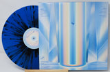 Back cover and blue splatter vinyl record of Fake Fever's Inside the Well with tracklist and abstract art