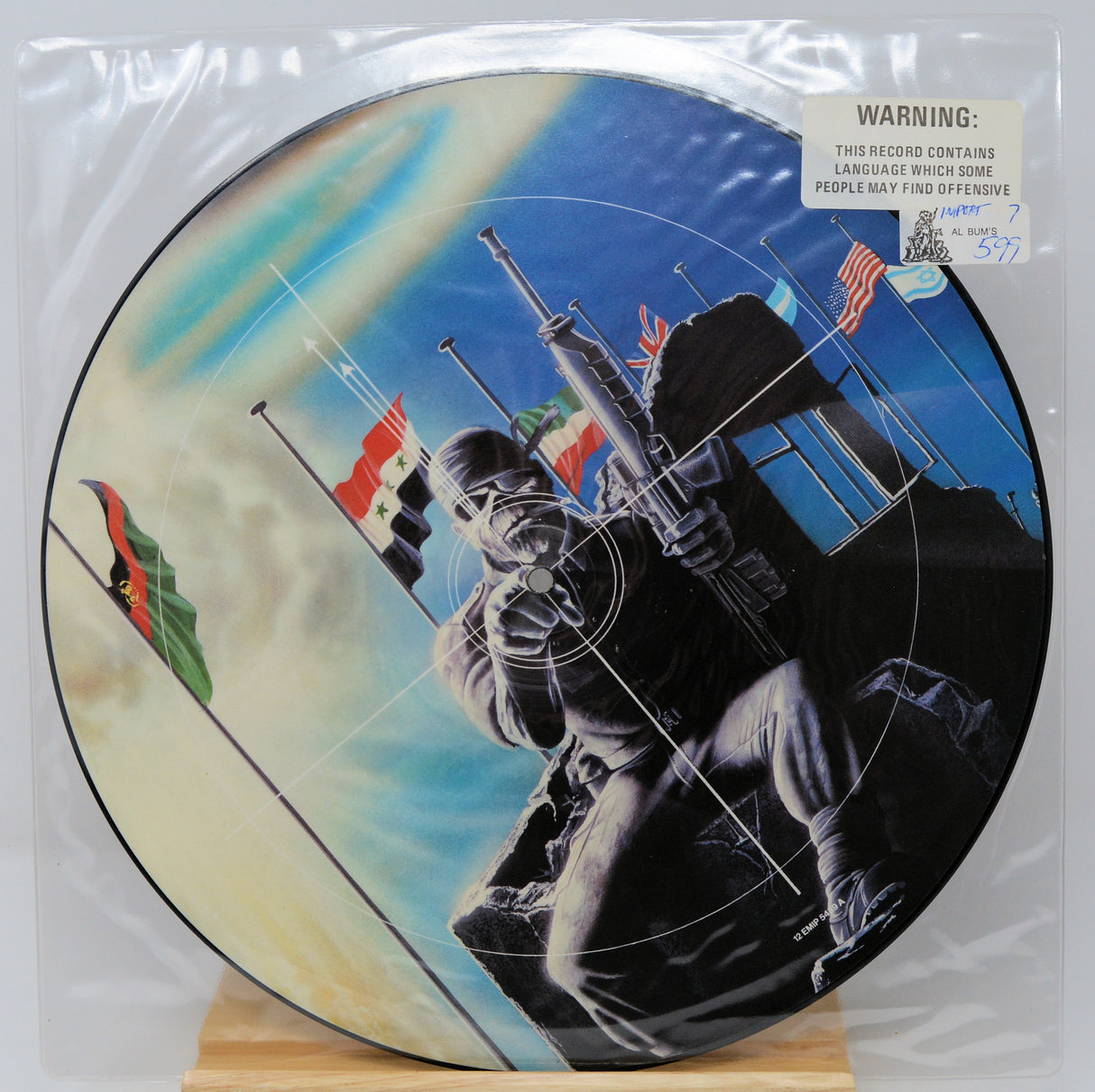 Vinyl record with a graphic design of a person holding a rifle and flags, on a white background.