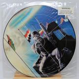 Vinyl record with a graphic design of a person holding a rifle and flags, on a white background.
