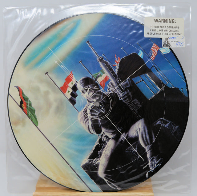 Vinyl record with a graphic design of a person holding a rifle and flags, on a white background.