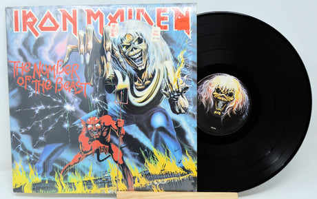 Vinyl record with a cover featuring a black and white photo of a building and crowd.