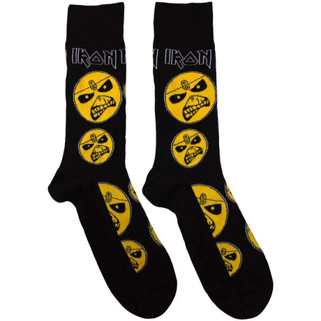 Black socks with yellow graphic designs on a white background
