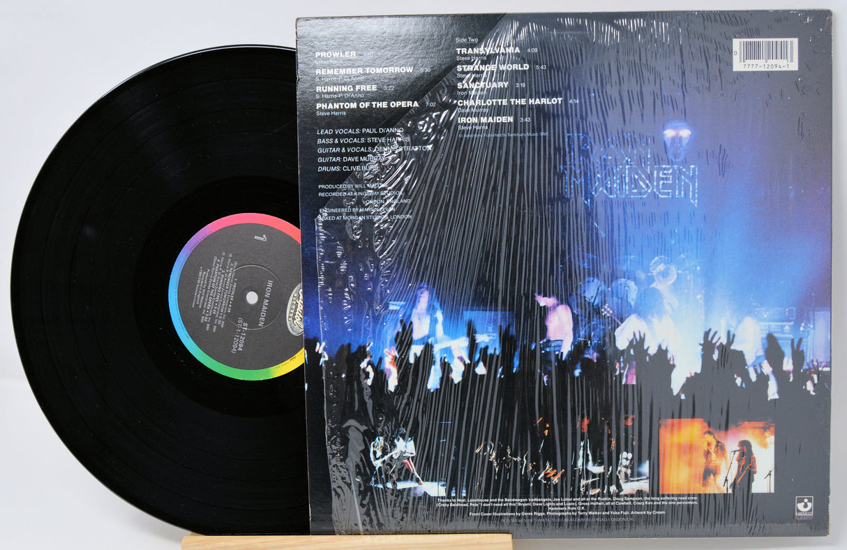 Vinyl record with colorful label and cover featuring a stage performance.