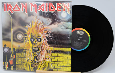 Vinyl record with Iron Maiden album cover featuring a skeleton with yellow hair.
