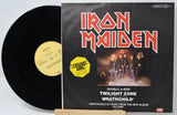 Vinyl record with Iron Maiden album cover featuring band members and album title.