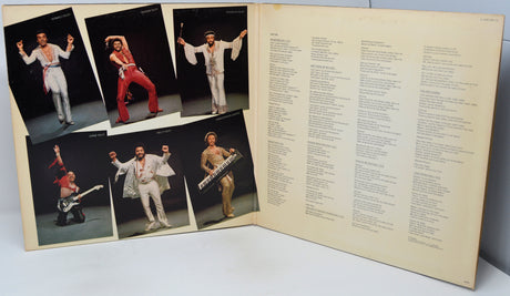 Vinyl record with cover featuring a performer in various poses and a list of songs.