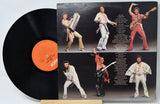 Vinyl record with a colorful cover featuring a band in various poses.
