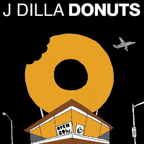 Album cover for 'J Dilla Donuts' with a large yellow donut over a building.