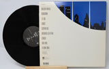 Vinyl record titled Night And Day by Joe Jackson showing the album and back cove with song titles in text.