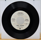 Vinyl record with 'Control' by Janet Jackson on a white background