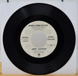 Vinyl record with 'When I Think of You' by Janet Jackson on a white background