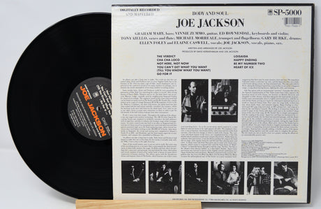 Vinyl record with its cover featuring Joe Jackson on a light gray background