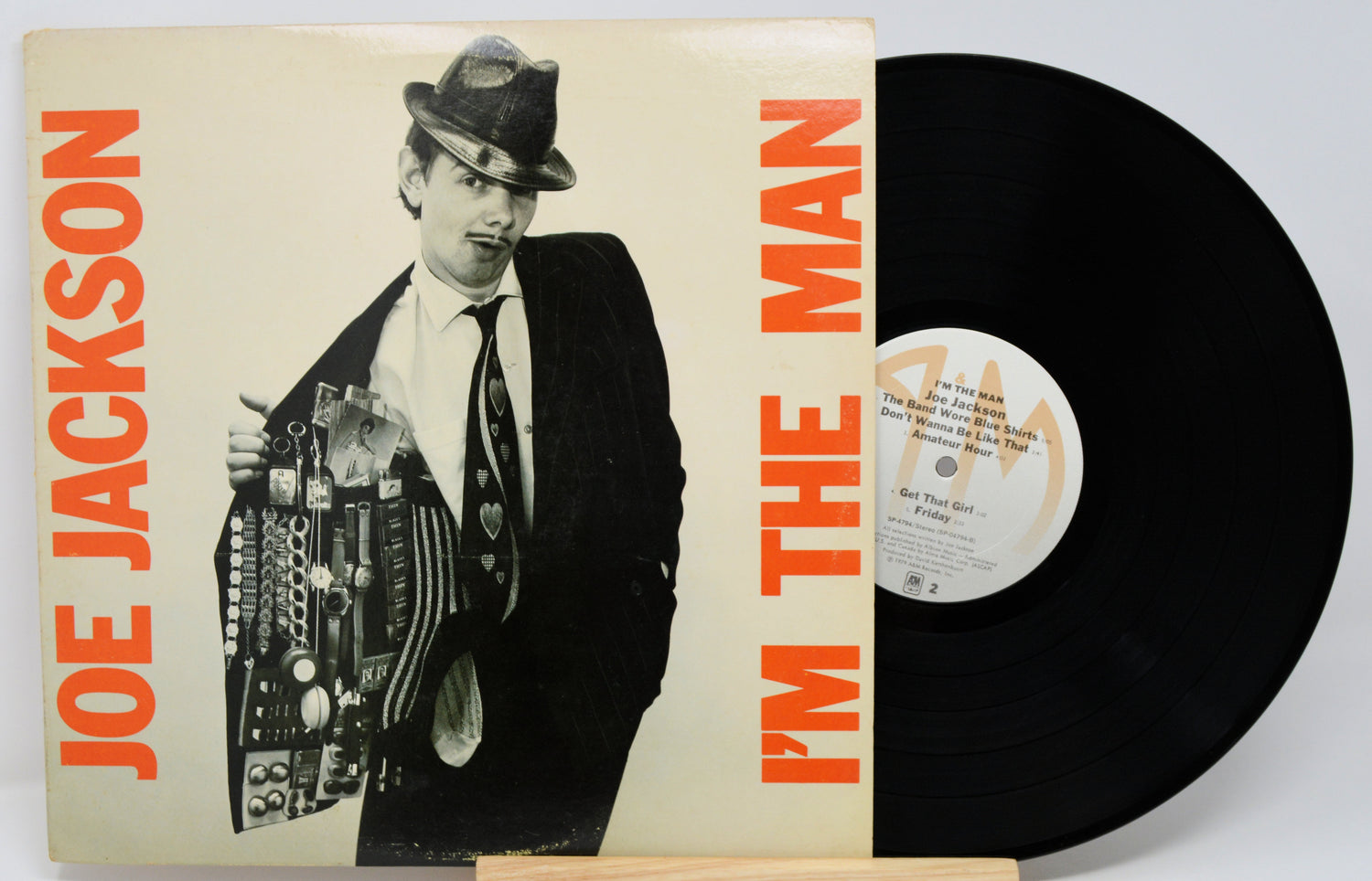 Vinyl record with cover featuring Joe Jackson and text 'I'm the Man' on a white background