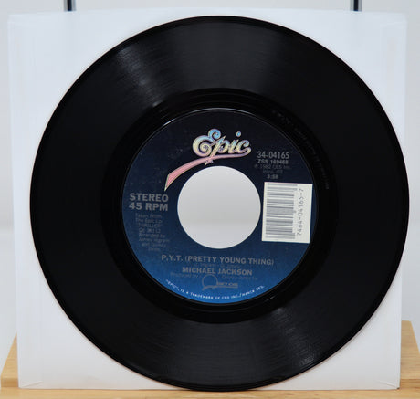 Black vinyl record with 'Epic' label on a white background