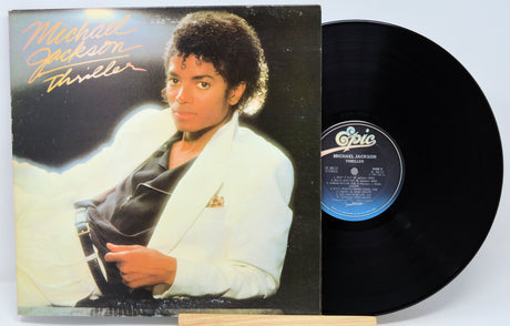 Michael Jackson 'Thriller' album cover and vinyl record on a white background