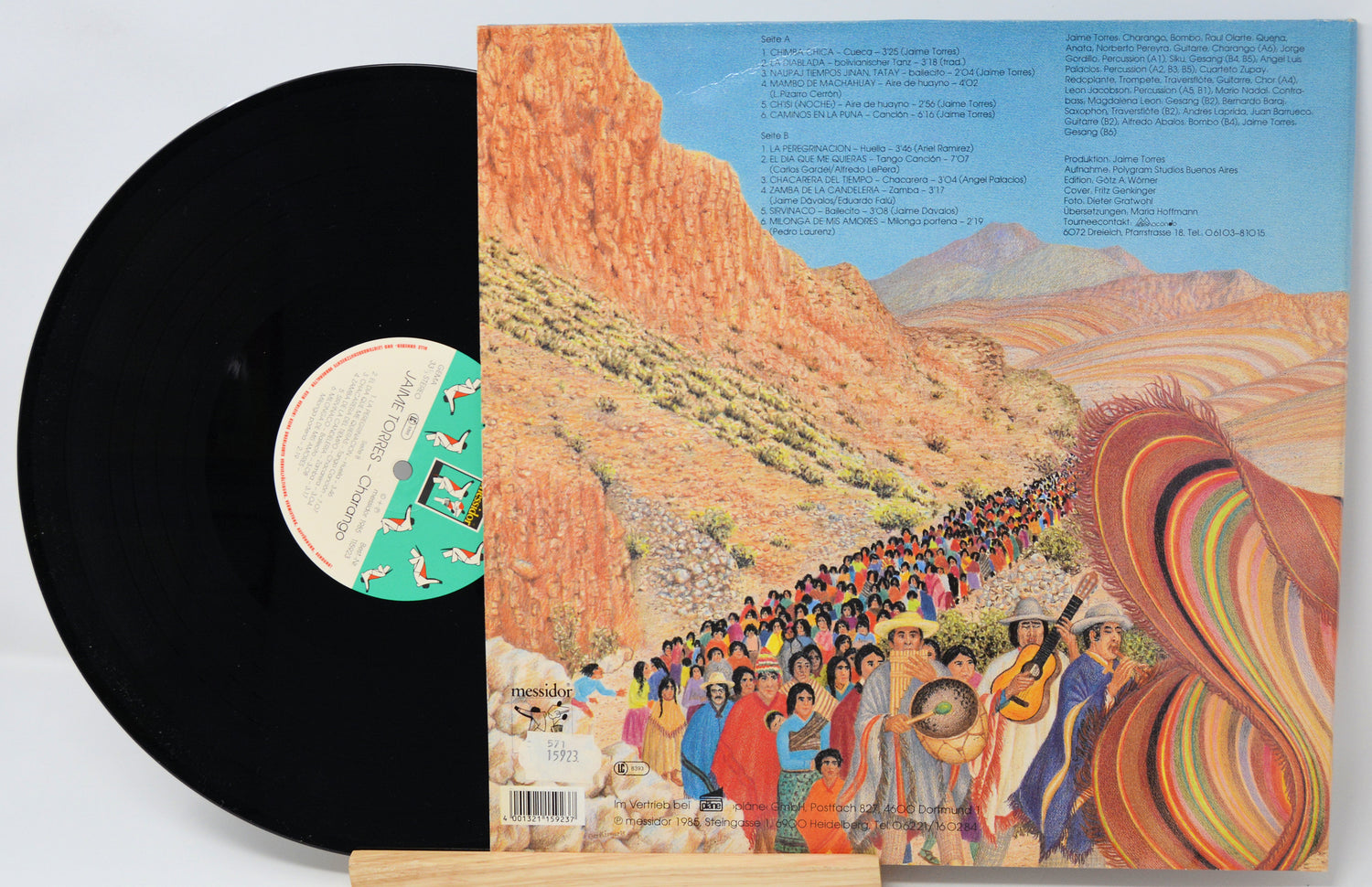 Vinyl record with a colorful album cover depicting a desert scene and people.
