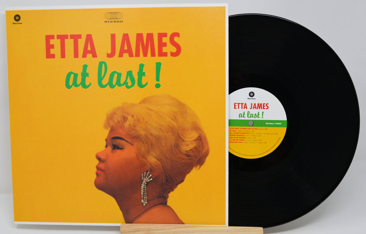 Vinyl record and cover of 'At Last' by Etta James on a white background