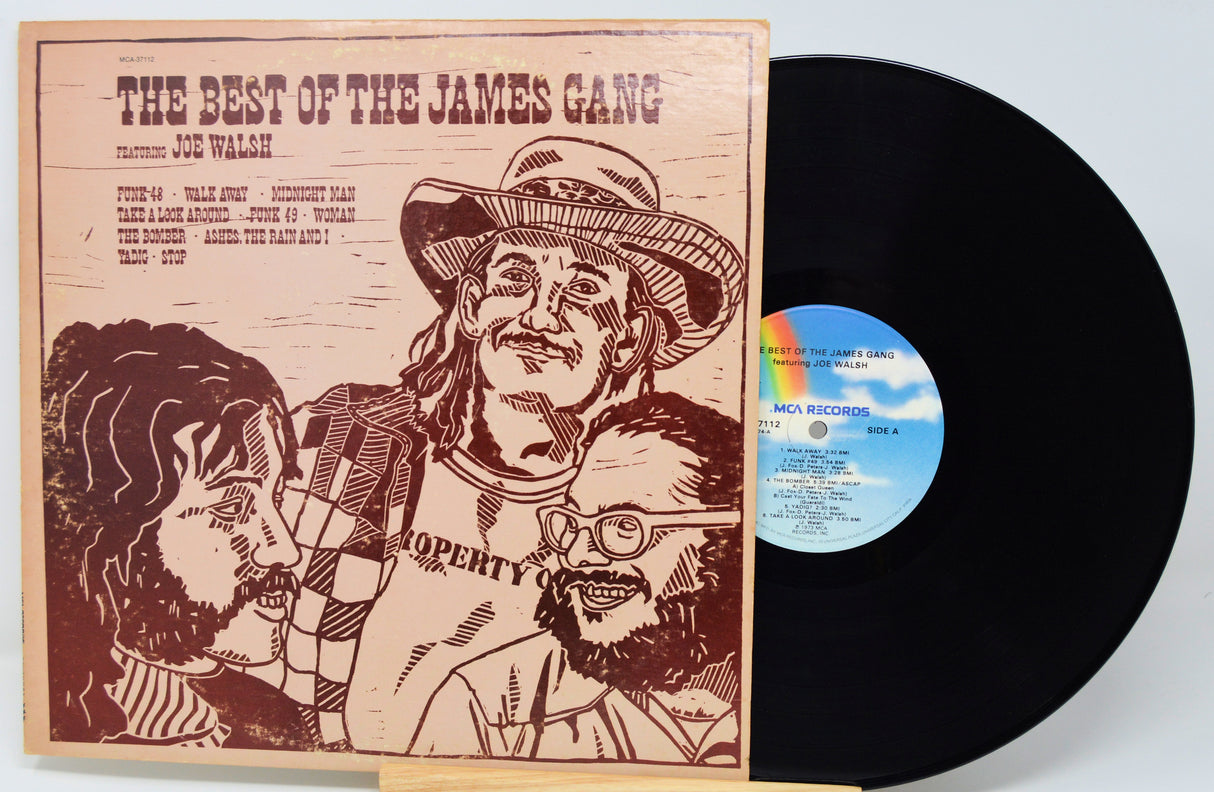 Vinyl record with cover featuring illustrations of a cowboy and another person, titled 'The Best of the James Gang'.