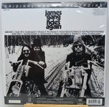 James Gang 'Again' 12-inch vinyl record LP cover, featuring a black and white photo of the band on motorcycles, with track listing and release details printed on the front.