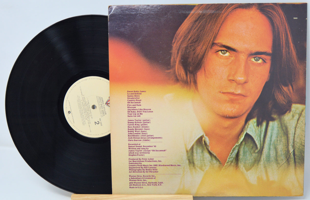 Vinyl record with a cover featuring a person's face on a light blue background