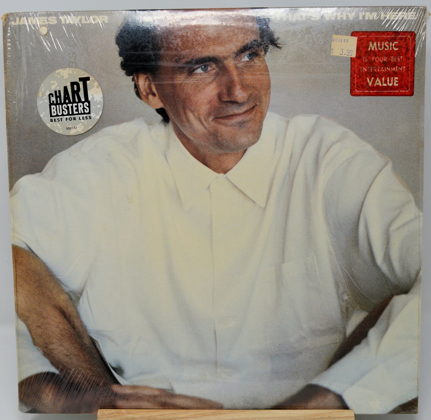Vinyl record cover with a person wearing a white shirt, featuring 'Chart Busters' and 'Music For Your Listening Pleasure' logos.