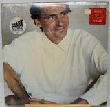 Vinyl record cover with a person wearing a white shirt, featuring 'Chart Busters' and 'Music For Your Listening Pleasure' logos.
