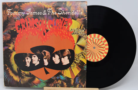 Vinyl record with colorful cover featuring Tommy James & The Shondells' 'Crimson & Clover' album.