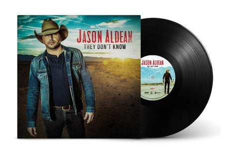 Jason Aldean 'They Don't Know' vinyl record album with the black LP partially pulled from the printed cover, shown on a clean white background.