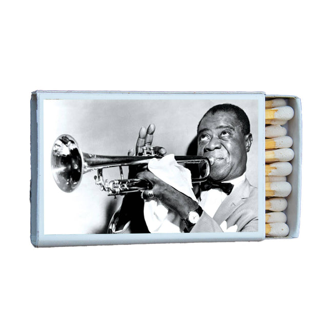 Vintage matchbox featuring a black and white photo of a trumpet musician