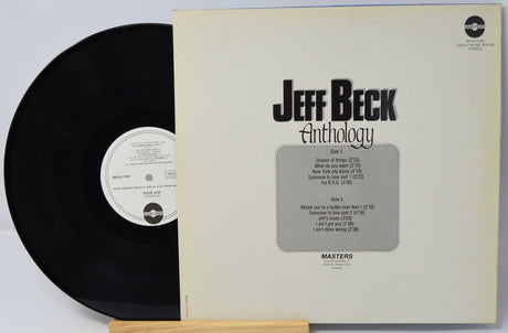 Vinyl record and cover of 'Jeff Beck Anthology' on a light gray background