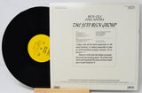 Vinyl record album shown with the black record partially pulled from the white paper sleeve. The sleeve features black text reading 'Reck-O-Cola Costa Nostra' and 'The Jeff Beck Group,' with a yellow label visible on the record.