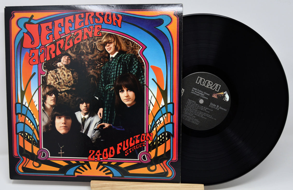 Vinyl record with colorful cover featuring a band and text