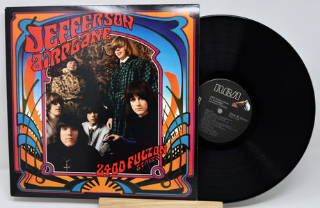 Vinyl record with colorful cover featuring a band and text