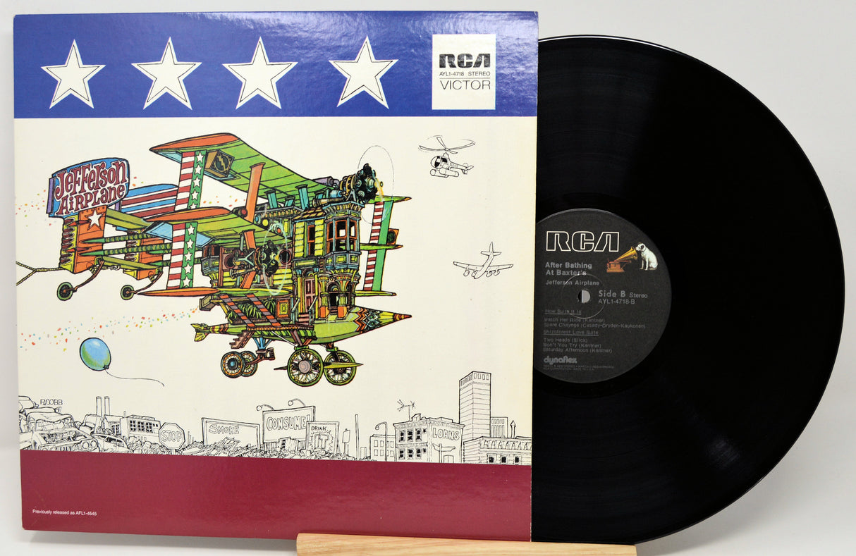 Vinyl record with colorful cover featuring a house on wheels and RCA logo.