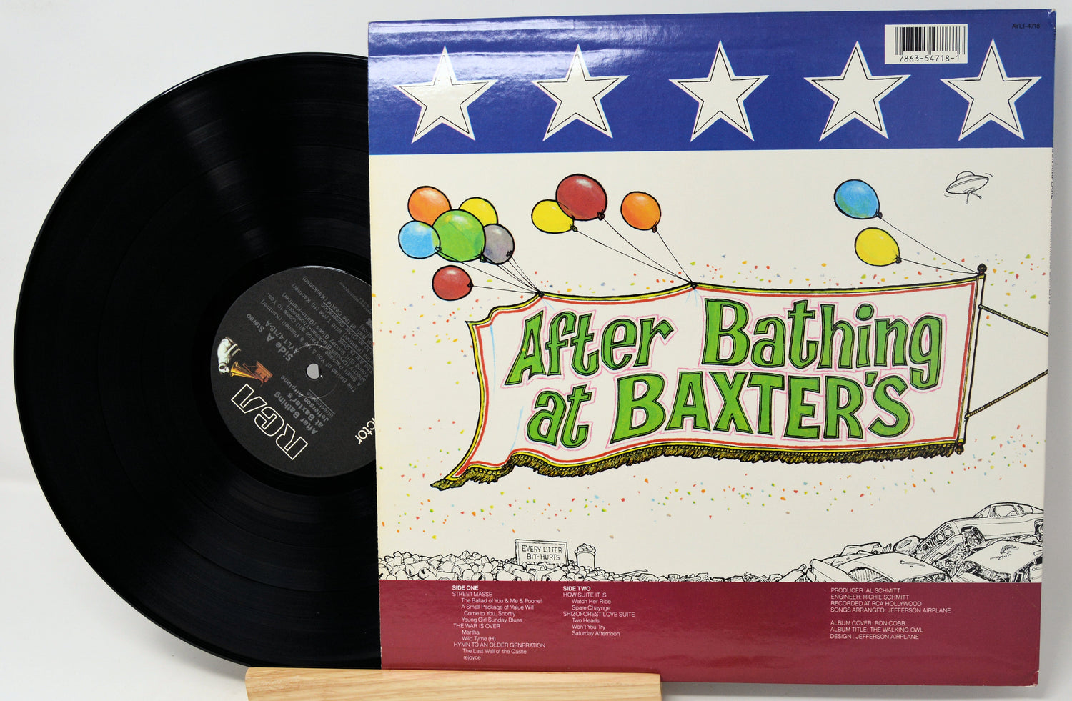 Vinyl record with 'After Bathing at Baxter's' album cover featuring colorful graphics.