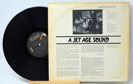 Vinyl record with cover displaying text and a black and white photo on a light blue background