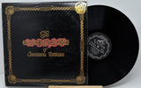 Vinyl record with ornate cover featuring 'The Worst of Jefferson Airplane' on a gray background