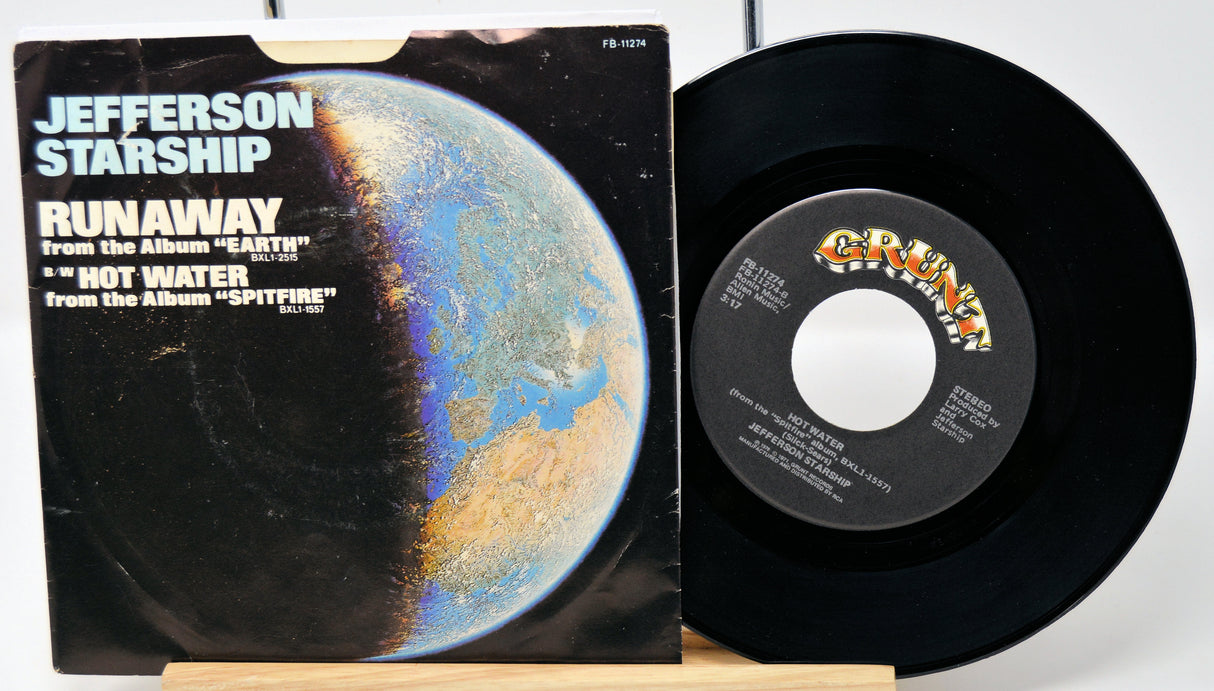 Vinyl record and cover with 'Jefferson Starship' album art on a white background
