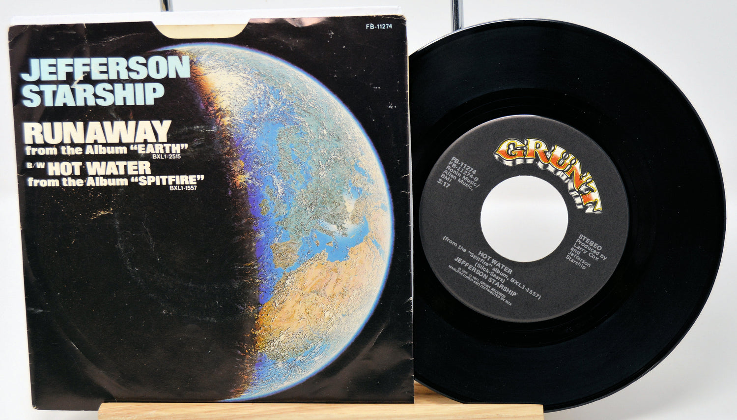 Vinyl record and cover with 'Jefferson Starship' album art on a white background