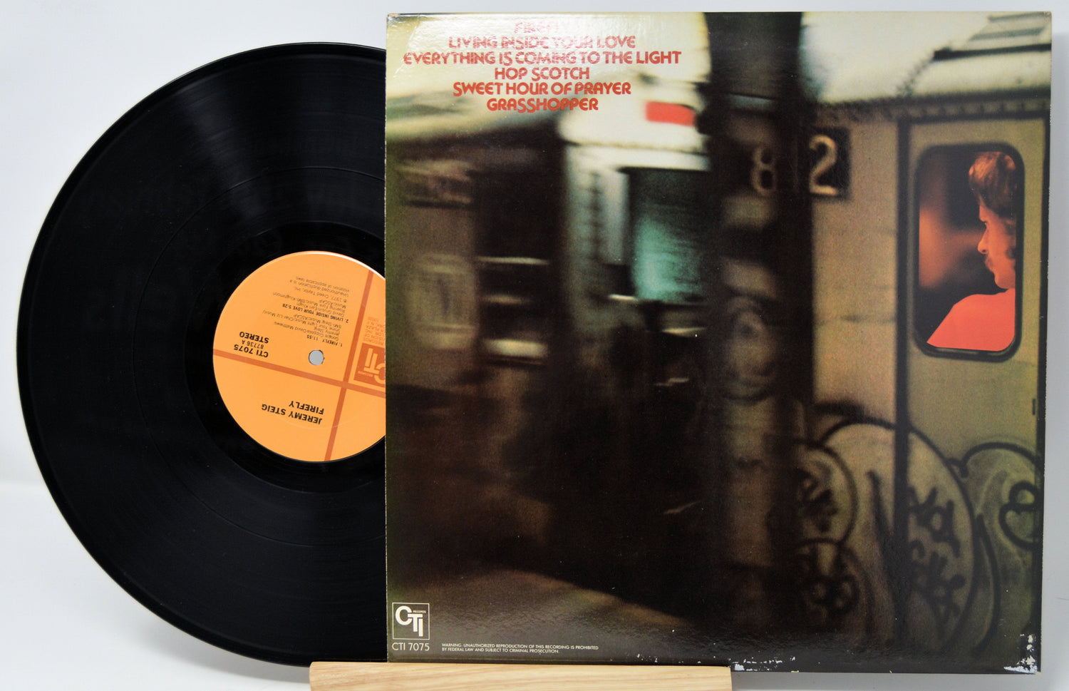 Back cover and vinyl record of Jeremy Steig's Firefly album with subway artwork