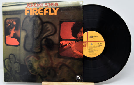 Front cover of Jeremy Steig's Firefly vinyl LP with Jeremy Steig playing flute in subway scene