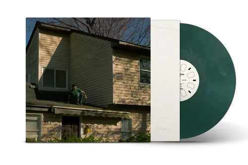 Green vinyl record with a cover featuring a house and person on a roof.