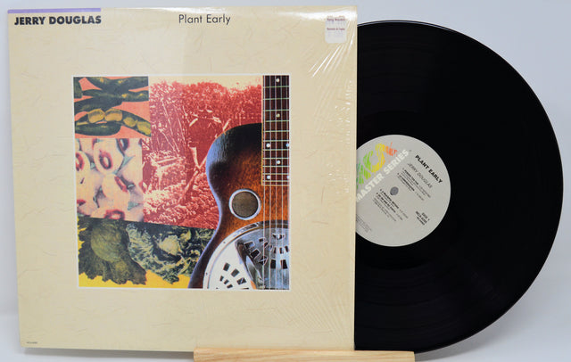 Vinyl record with cover featuring a guitar and colorful design, by Jerry Douglas.