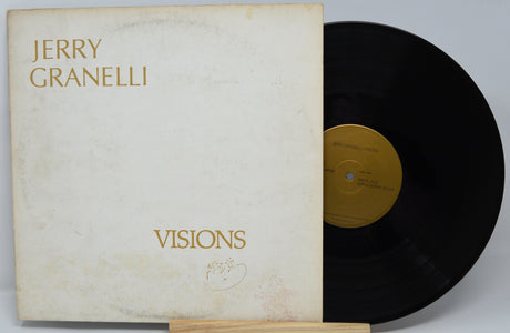 Vinyl record with cover titled 'Visions' by Jerry Granelli on a white background