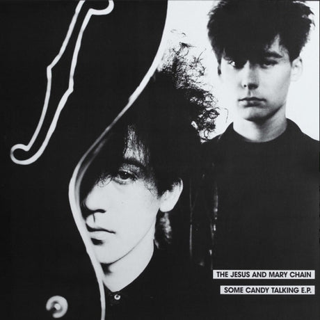 Black and white album cover with two individuals and text 'The Jesus and Mary Chain Some Candy Talking E.P.'
