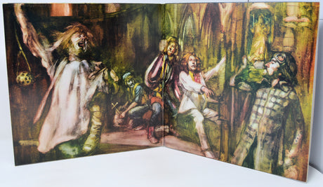 Illustrated book open to a page with characters in a fantasy setting