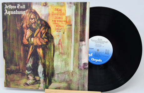 Vinyl record with cover featuring a person in a robe and album title 'Aqualung' by Jethro Tull.