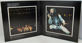 Album cover with two images: one of a night scene and another of a person singing into a microphone.