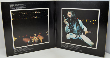 Album cover with two images: one of a night scene and another of a person singing into a microphone.